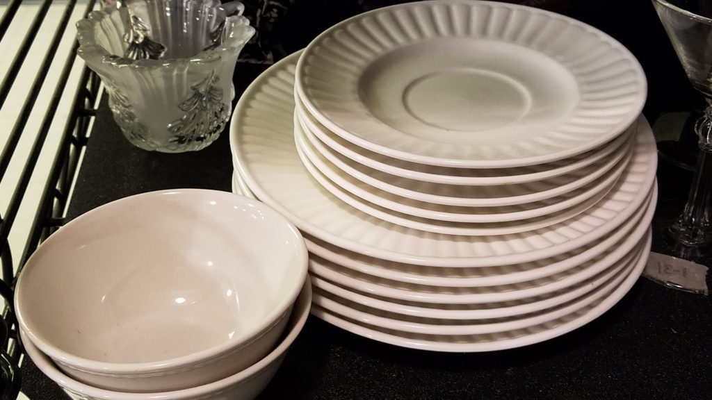 White plates on a shelf