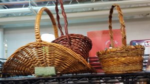 Two wicker baskets on a shelf