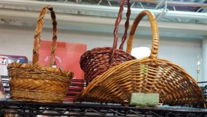 Two wicker baskets on a shelf