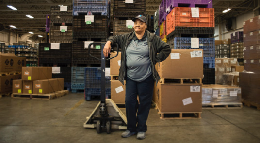 Woman standing in warehouse