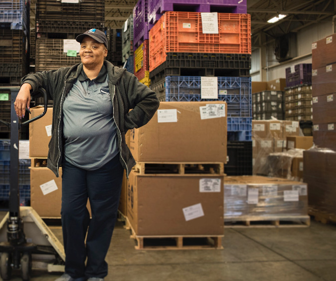 Woman worker in warehouse