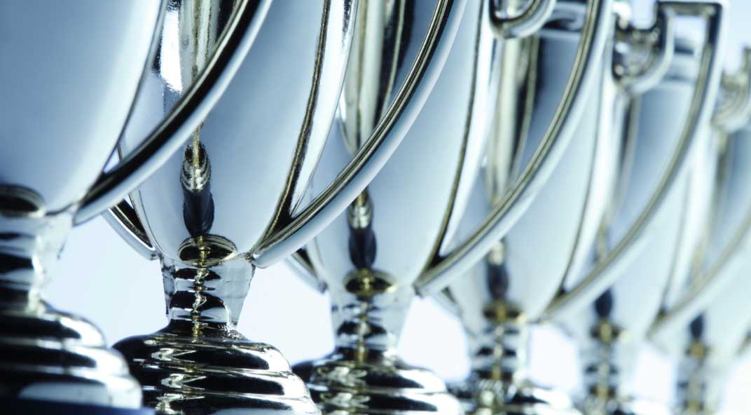 Closeup of a line of trophies