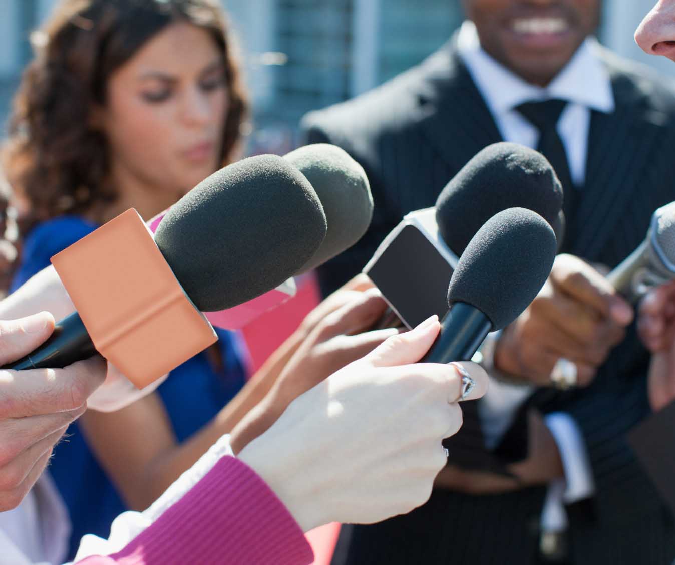 Closeups of microphones at a press conference