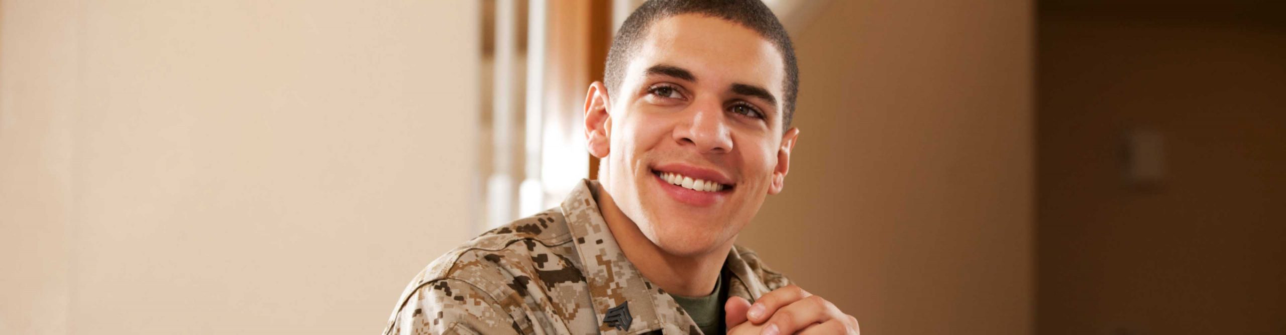 Male service member poses for camera