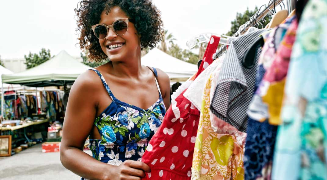 Woman views clothes on rack