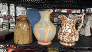 Three pitchers on a shelf at Ohio Valley Goodwill