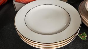 White and gold plate set from Ohio Valley Goodwill