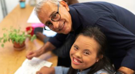 Employment coach helping young girl