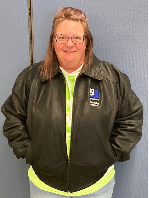 Woman smiling wearing a black jacket