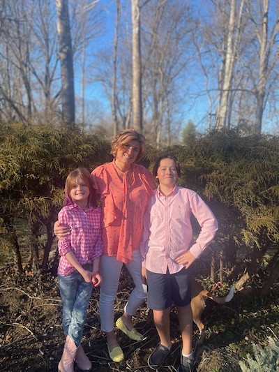 Mom and two kids in Goodwill fashions