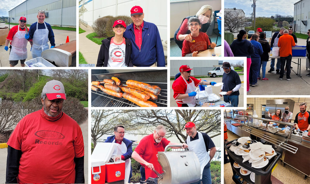 Goodwill's Management team grilling hot dogs for Reds Opening Day Celebration