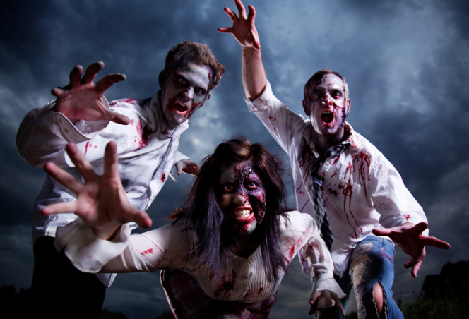 Three people dressed as zombies