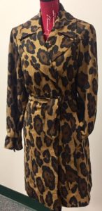 Cheetah print trench coat on mannequin from Goodwill