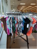 Clothing rack at Goodwill with baby clothes
