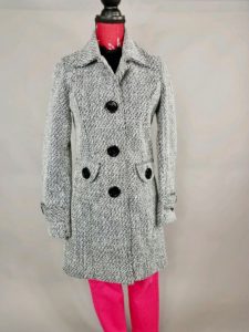 Gray winter coat on mannequin with pink pants