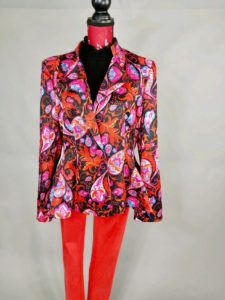 Mannequin dressed in orange paisley blazer with red pants