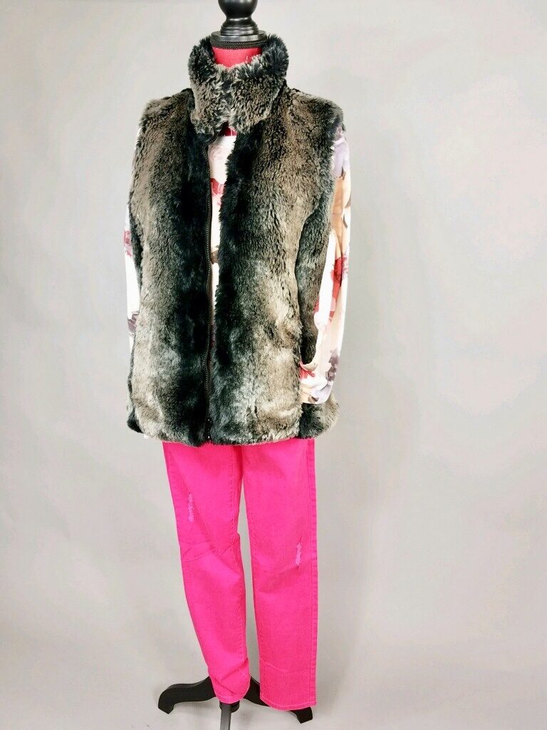 Mannequin dressing in brown fur vest with pink pants