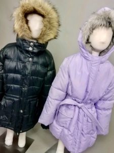 2 child mannequins in coats from Goodwill