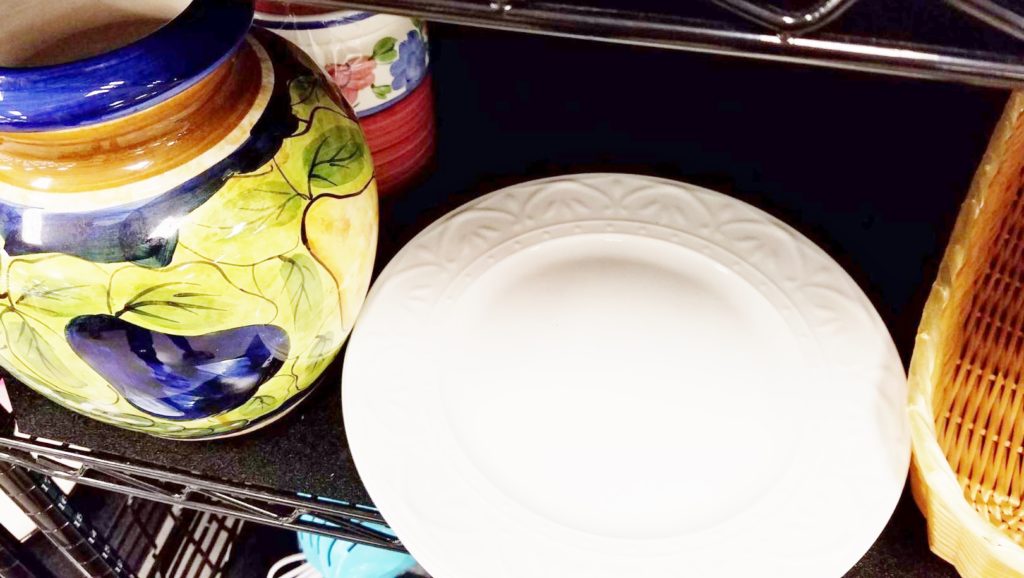 Porcelain vase and kitchen plate on display
