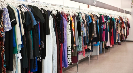 Clothing rack filled with assorted garments in store