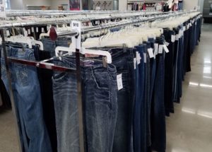 Jeans on a rack at Goodwill store