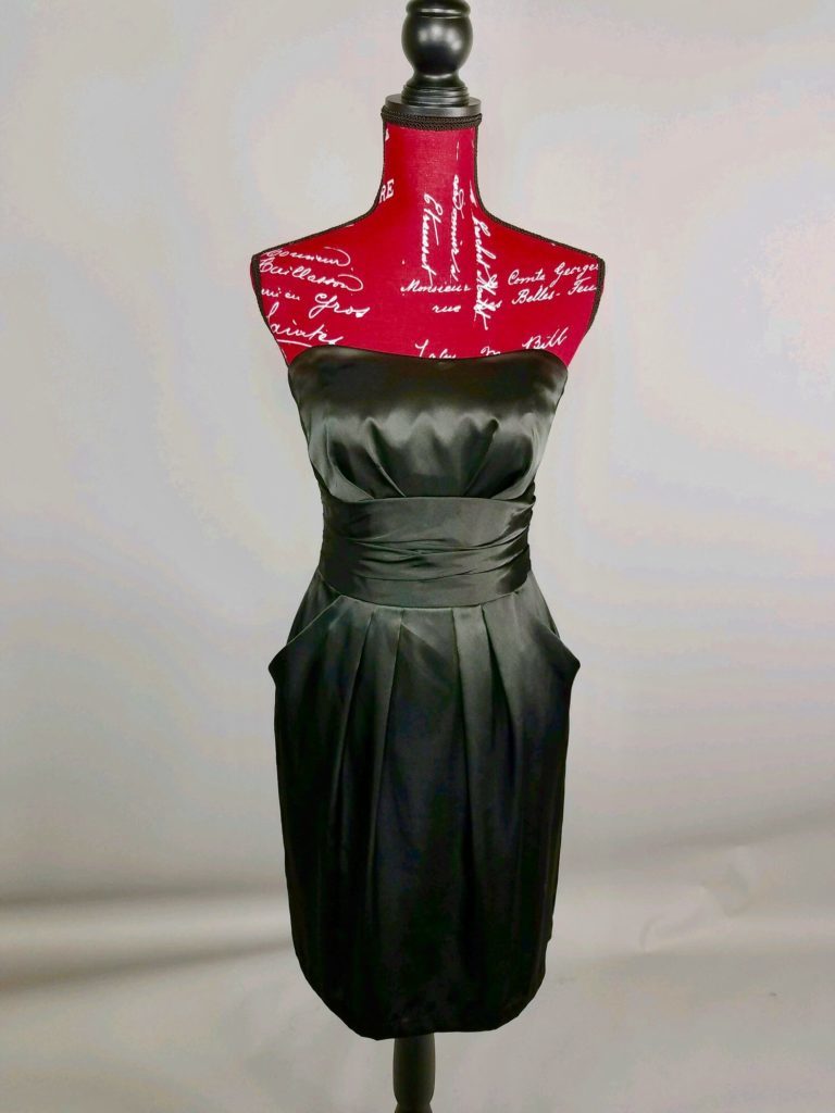 Mannequin dressed in black strapless dress