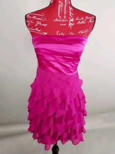 mannequin dressed in hot pink homecoming dress
