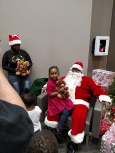 Santa shares holiday joy with a little girl.