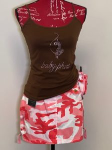 Mannequin dressed in brown tank top and pink camouflage skirt. 