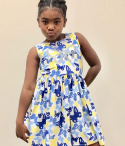 Little girl in back to school dress Goodwill