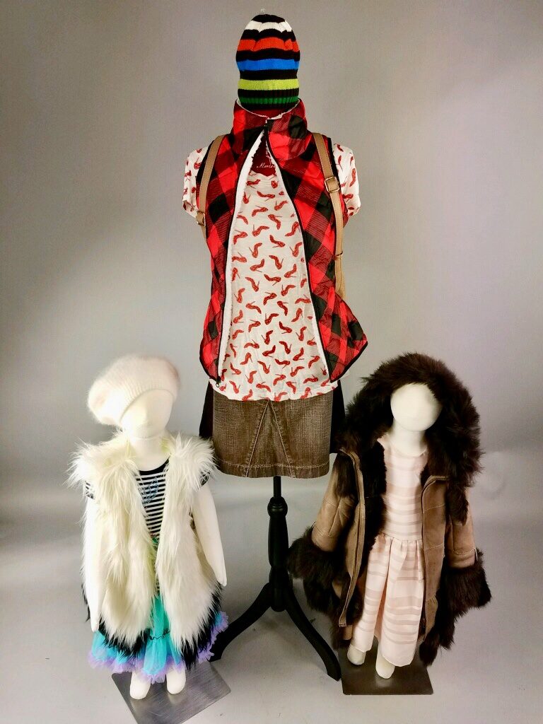 Three mannequins displaying vests, coats, and jackets