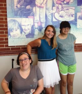 Pictured are Coordinator Kala Koons with Maggie Neumann and Rachel Ma, students. 