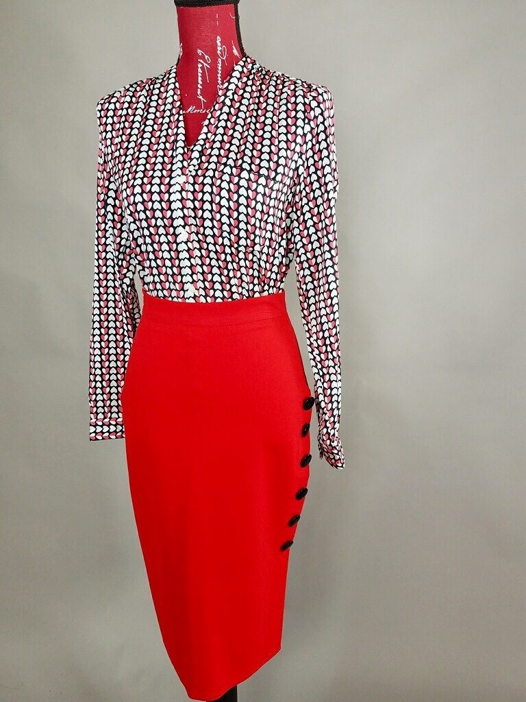 Mannequin dressed in Red and black blouse with red pencil skirt from Goodwill
