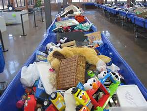 Blue bin filled with items at Goodwill outlet store