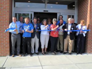 Oxford Ribbon-Cutting Team Including City of Oxford leaders featuring Mayor Kate Rousmaniere in red.