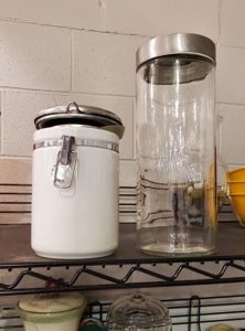 white and clear storage containers from Goodwill