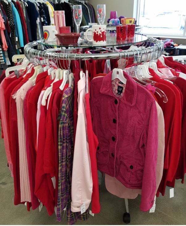 Display of Valentine's Day clothing in red and pink colors at Ohio Valley Goodwill