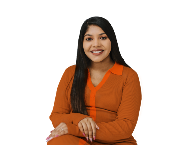Smiling woman in orange top with folded hands