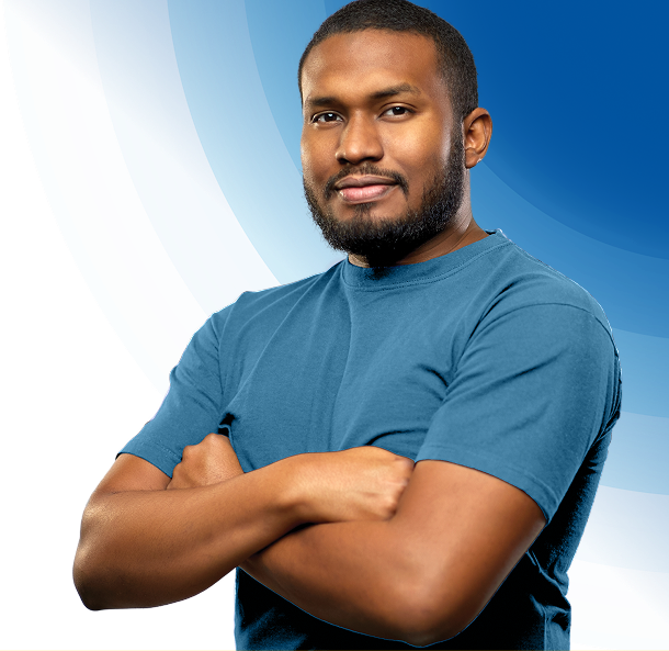 Confident man with crossed arms on blue background